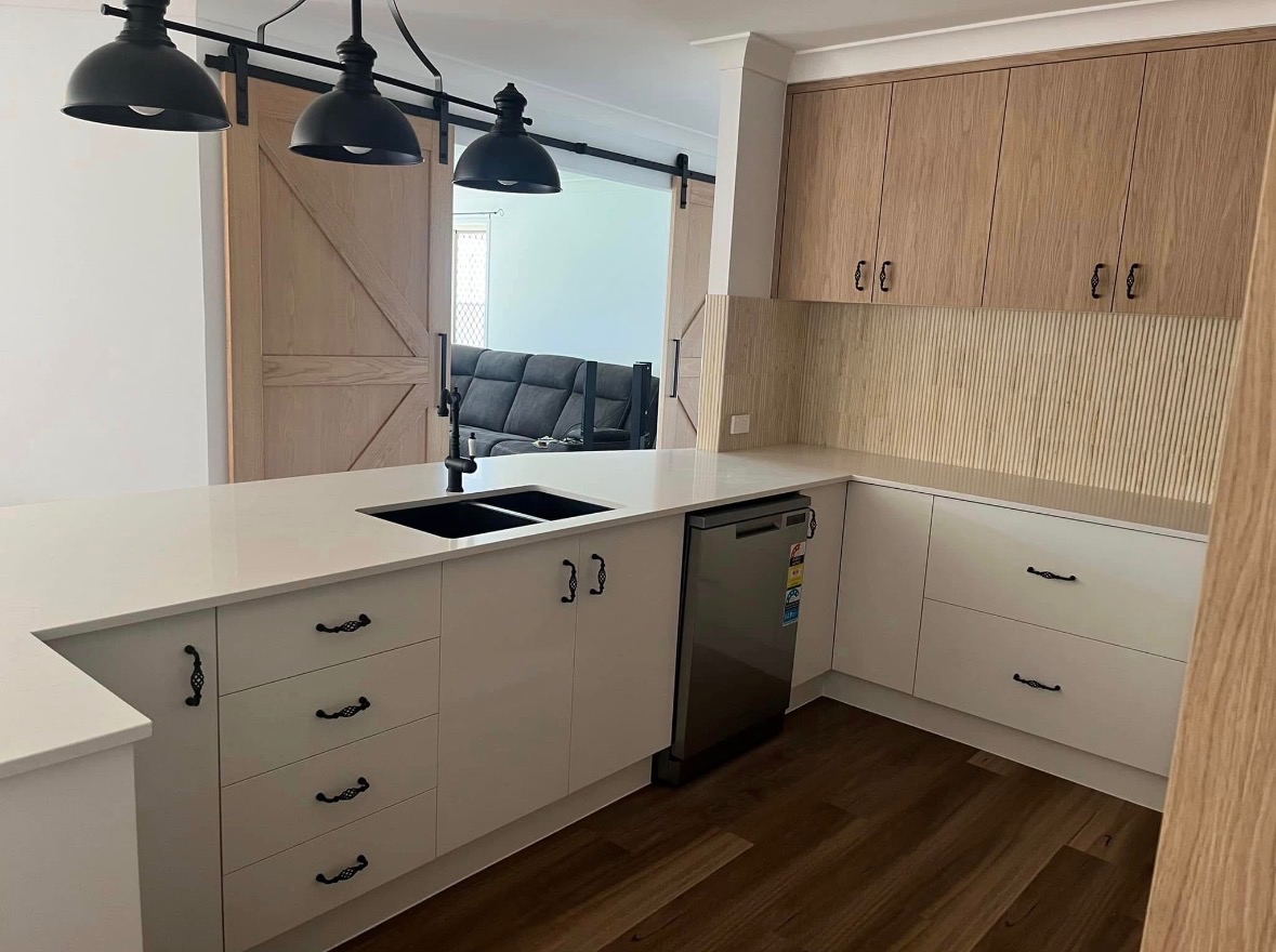 Farmhouse kitchen with barn doors and reeded splashback