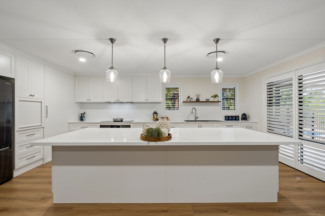 Full white Shaker kitchen with stone island bench and oak floors — 380 Old Toowoomba Rd, Placid Hills